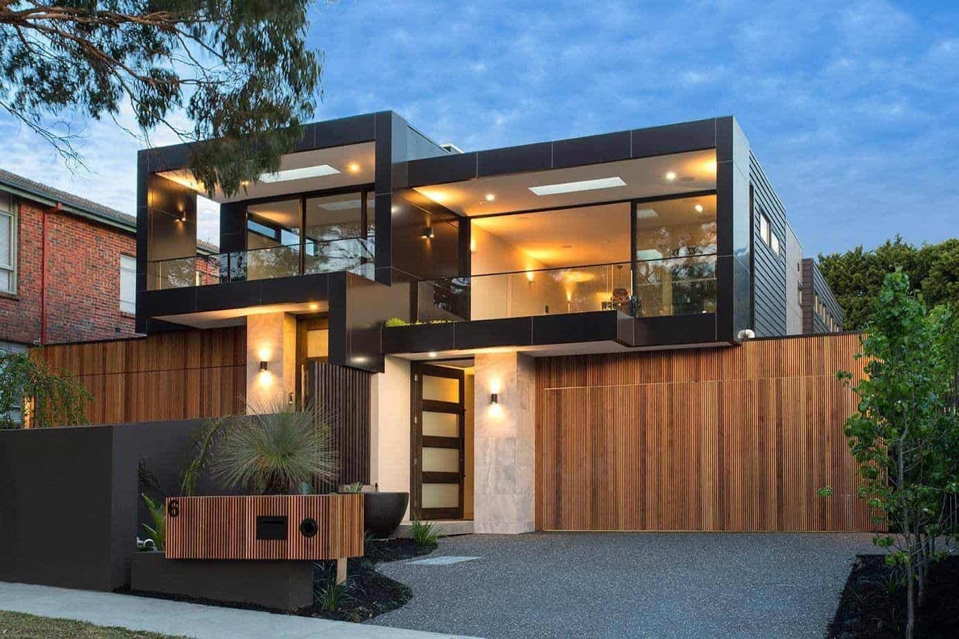 Modern multi-story house with dark and wood exterior.