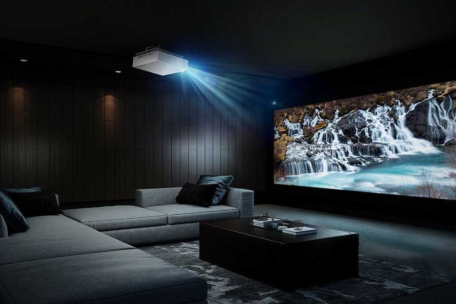 Home theater with projector displaying waterfall scene.