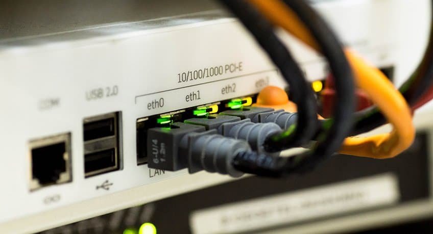 Close-up of network router with connected ethernet cables.
