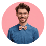Headshot of a smiling man with glasses and a bow tie.