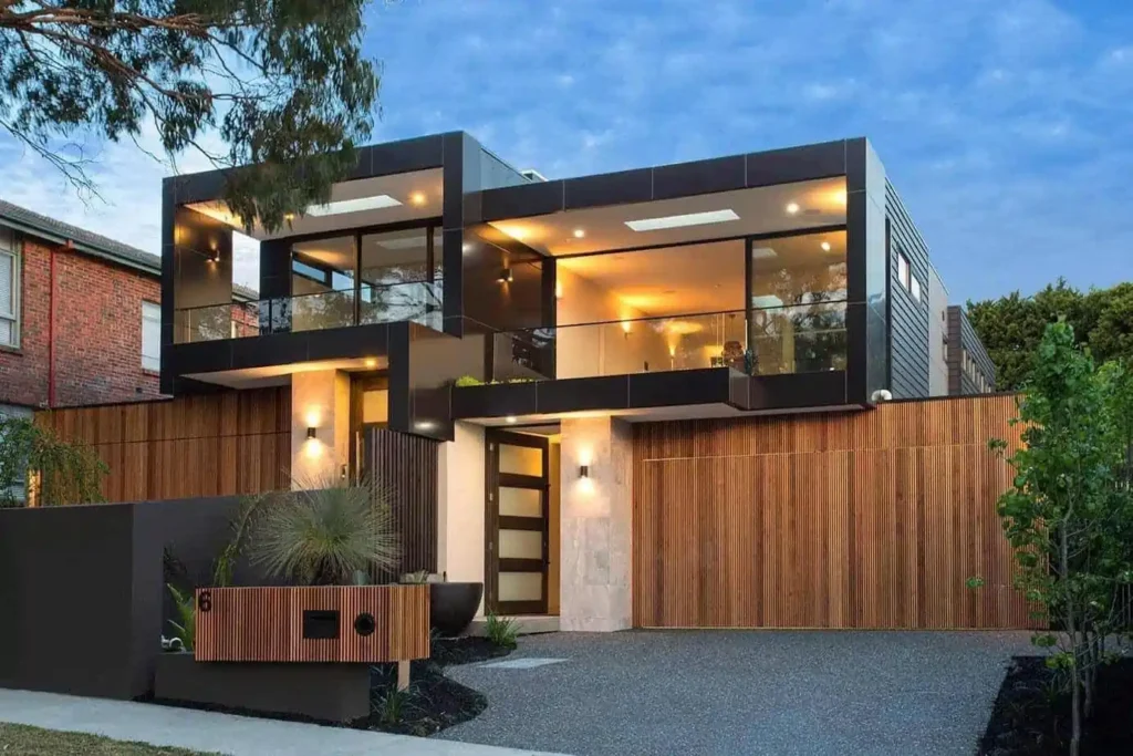 Modern multi-story house with dark and wood exterior.